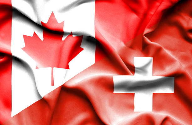istock Waving flag of Switzerland and Canada 666718092