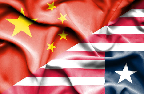 istock Waving flag of Liberia and China 666723368