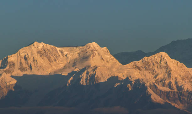 Kangchenjunga Kangchenjunga is the third highest mountain in the world, and lies partly in Nepal and partly in Sikkim, India.  This view is from Tiger hill at the time of Sunrise. tiger hill stock pictures, royalty-free photos & images