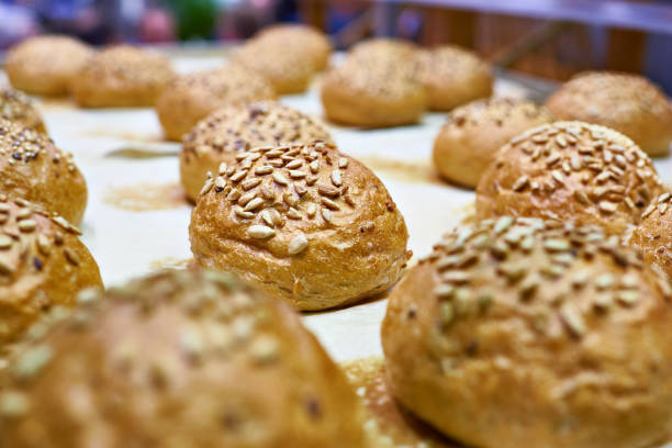istock Fresh bread buns with sunflower seeds 666728988