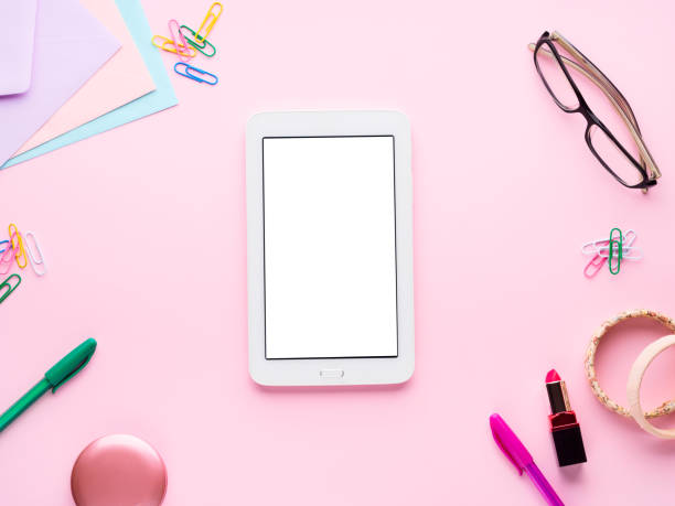 Pink flat lay with gadget stationery glasses lipstick