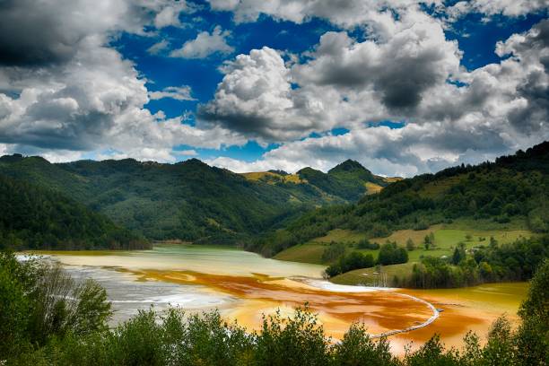 Pollution of a lake with contaminated water from a gold mine Pollution of a lake with contaminated water from a gold mine gold mine photos stock pictures, royalty-free photos & images
