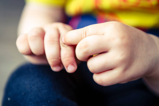 istock detail of child hands 666744476