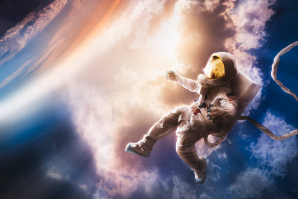 astronaute flottant dans l’atmosphère - apesanteur photos et images de collection