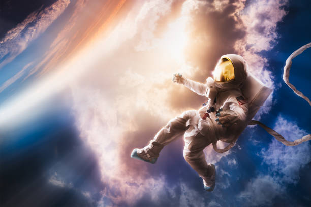 Astronaut floating in the atmosphere Astronaut floating in the stratosphere near a planet (No elements of NASA were used to make this image) zero gravity stock pictures, royalty-free photos & images