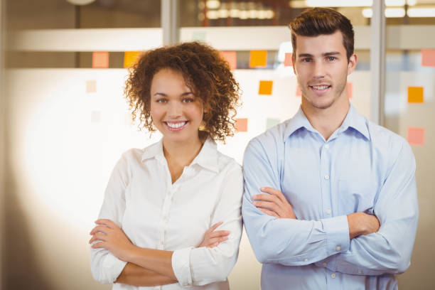 istock Business people standing with arms crossed 666756472