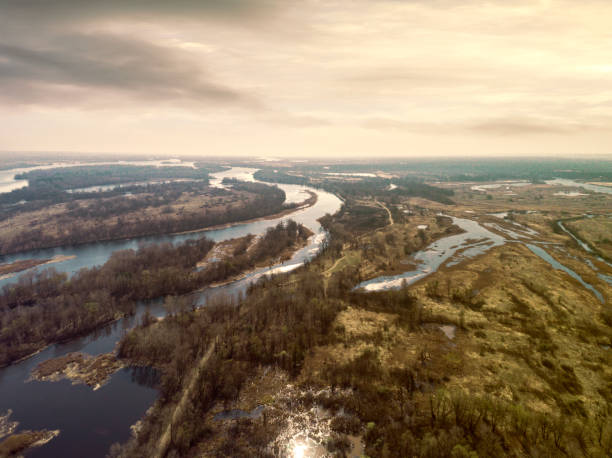 Early spring landscape from above. Aerial view. Early spring landscape from above. Aerial view. Outdoor. Green field with river and backwater skyline. dnieper river stock pictures, royalty-free photos & images