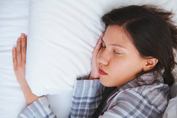 istock Woman sleeping in bed 666760226