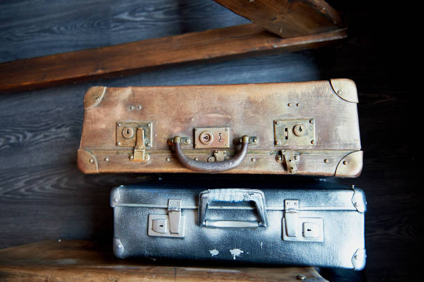 istock Two old battered suitcase with vintage hardware painted in silver and gold paint 666760354
