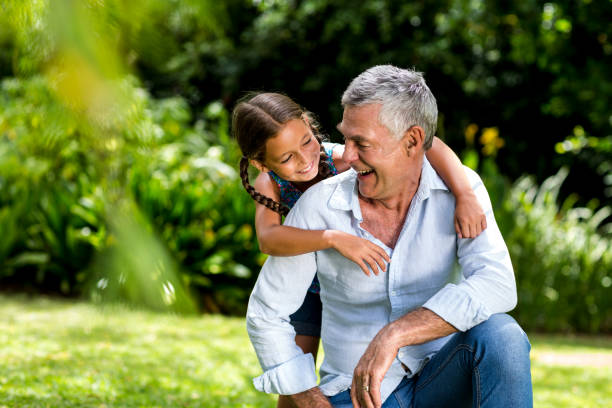 istock Grandfather and grandaughter playing at yard 666767202