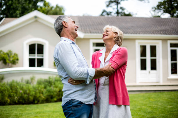 istock Happy senior couple hugging in yard 666773060