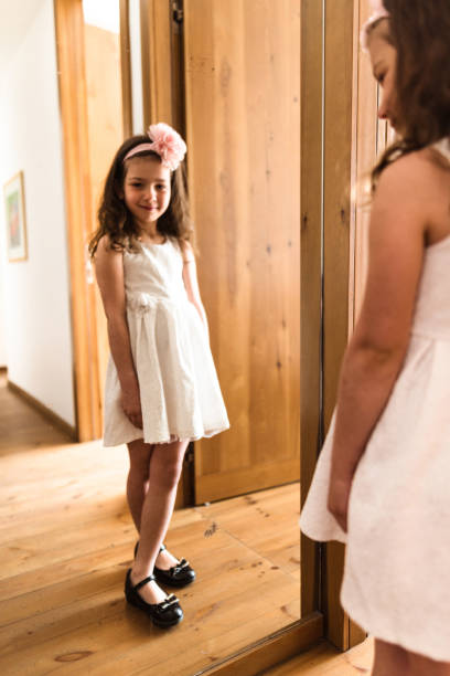 istock vanity kid in front of the mirror 666773510