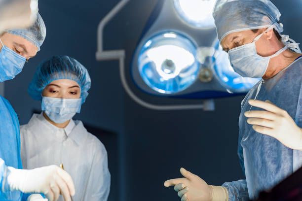istock Serious doctors in operating theatre 666776838
