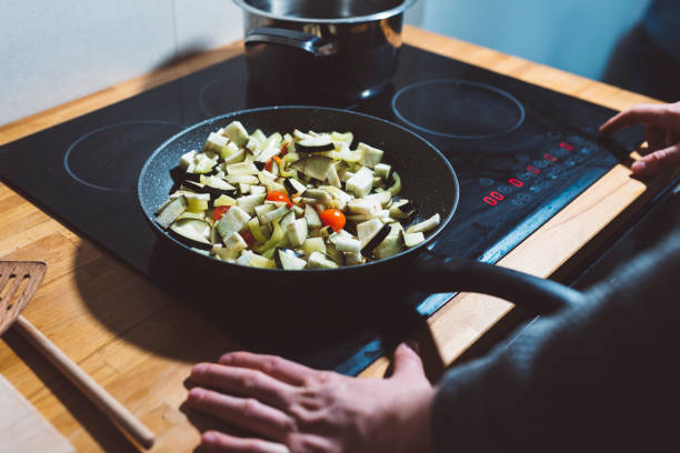 istock Man and the stove 666778926