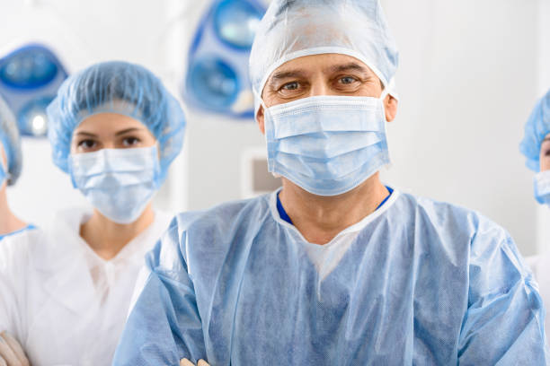 istock Cheerful male doctor among colleagues 666779688