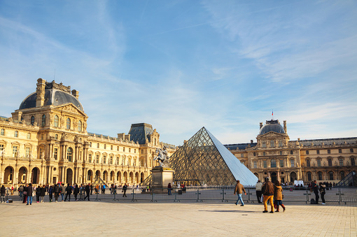 PARIS - NOVEMBER 1: The Louvre Pyramid on November 1, 2014 in Paris, France. It serves as the main entrance to the Louvre Museum. Completed in 1989 it has become a landmark of Paris.