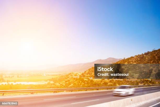 Highway Through The Mountains Stock Photo - Download Image Now - Asphalt, Blurred Motion, Car