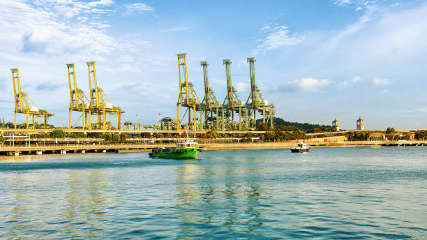 istock Ships and loading cranes in Sentosa Island Singapore 666789326