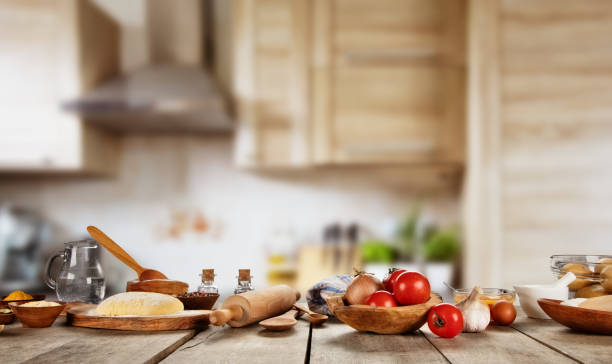 Baking ingredients placed on wooden table stock photo