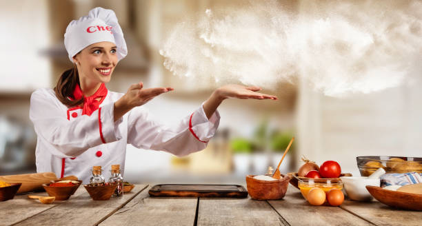 istock Young chef woman cooker pointing 666789644