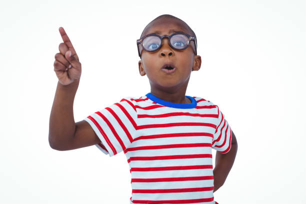 Cute boy shaking finger saying no to the camera on white screen