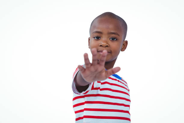 istock Boy holding his hand on the camera 666792498