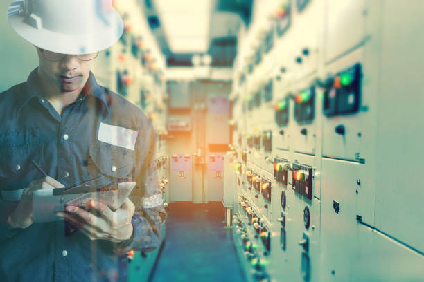 istock Double exposure of  Engineer or Technician man working with tablet in switch gear electrical room of oil and gas platform or plant industrial for monitor process, business and industry concept 666795906