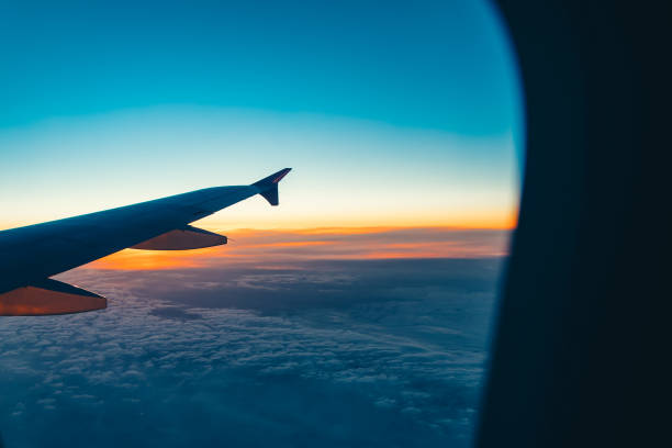 istock Aerial view from airplane window at sunset 666799094