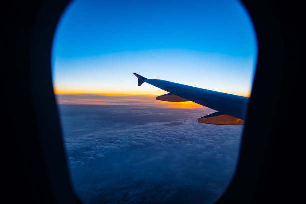 istock Aerial view from airplane window at sunset 666801552