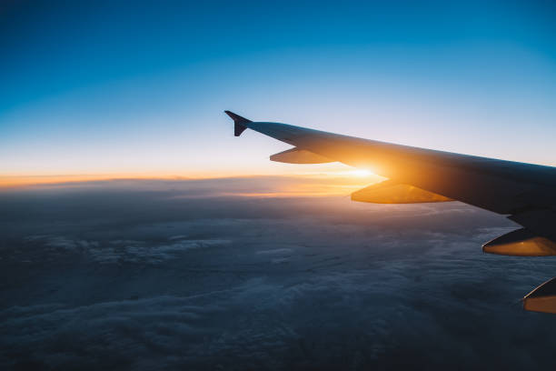 istock Aerial view from airplane window at sunset 666801598