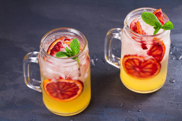 istock Bloody orange cocktail garnished with mint in the jars 666802286