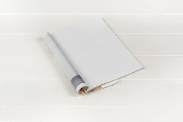 istock Mock-up magazines or catalog on white wooden table background. 666805280