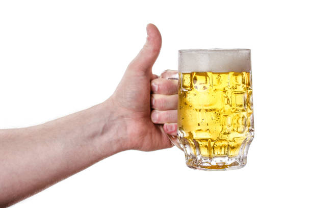 A mug of light beer in his hand. Isolated background
