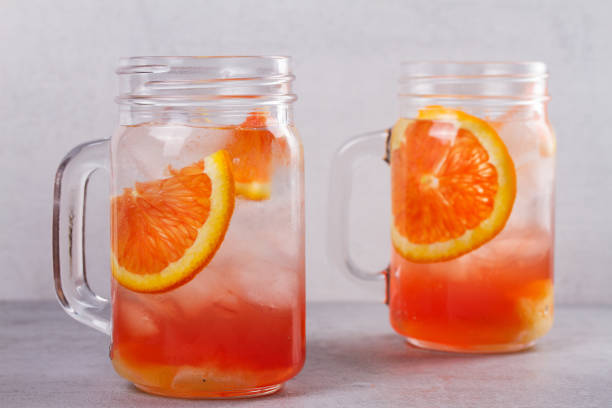 istock Orange cocktail garnished with thyme in jars 666808678