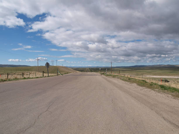 istock A country road with sunny sky and cloudy sky 666817262