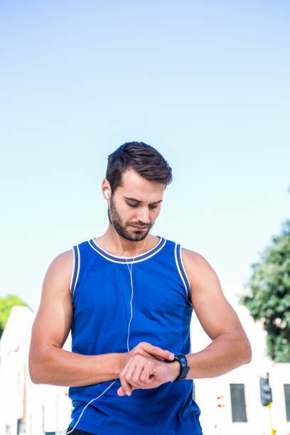 istock Handsome athlete setting heart rate watch 666817422