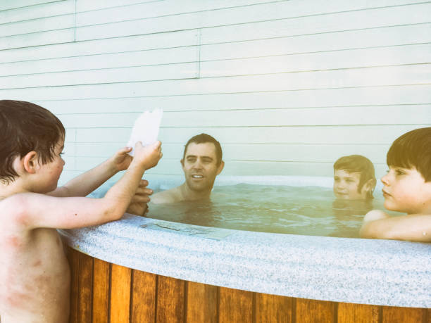istock Cold ice with hot tub brothers and dad 666823916