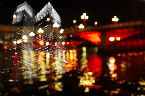 istock city building light and bridge the river in dark night 666827140
