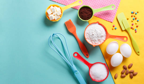 Colorful Baking Ingredients Colorful still life of cake baking with copy space. kitchen utensil stock pictures, royalty-free photos & images