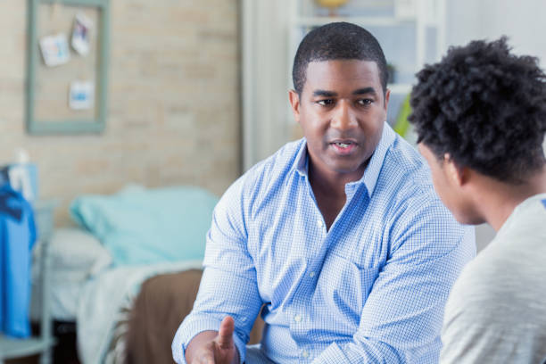 istock African American dad has serious conversation with his son 666835376