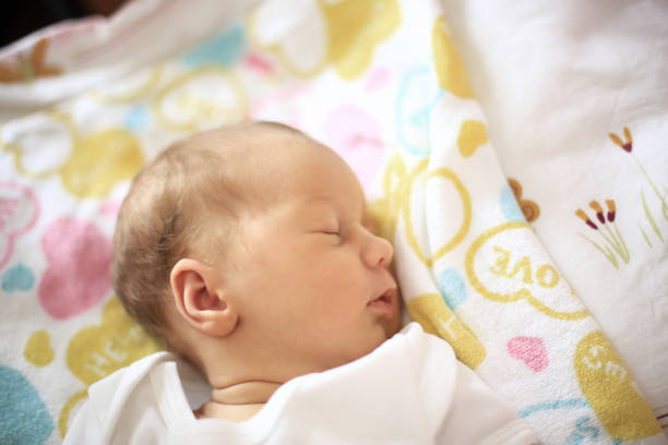 istock newborn baby sleeping in the crib on a blanket 666845754