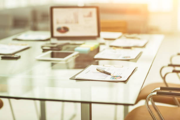 istock workplace with laptop and working documents for the business team in a modern office 666848696