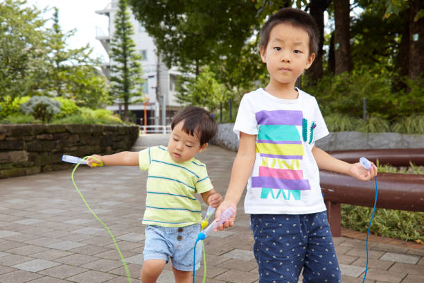 istock Brother and sister playing in the park 666849158