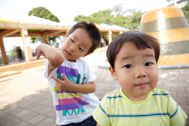istock Brother and sister playing in the park 666849168