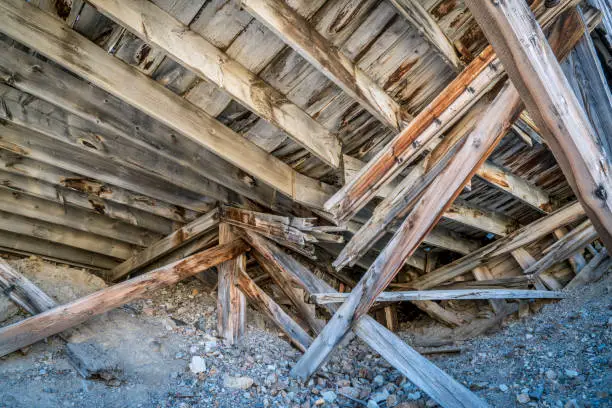 collapsed wooden buiding of a gold mine in Rocky Mountains, Colorado