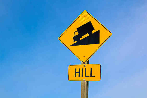 approaching hill sign along highway - downgrade imagens e fotografias de stock