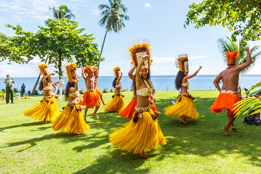 PAPEETE, FRENCH POLYNESIA – APRIL 19, 2017 : Polynesian women perform traditional dance in Tahiti  Papeete, French Polynesia. Polynesian dances are major tourist attraction of luxury resorts of French Polynesia