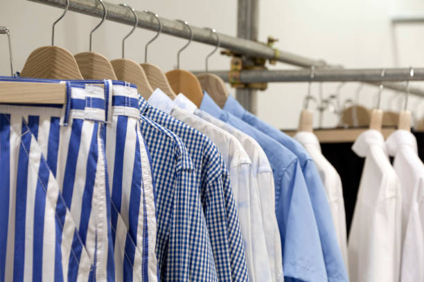 istock clothes hanging on the rack 666864034