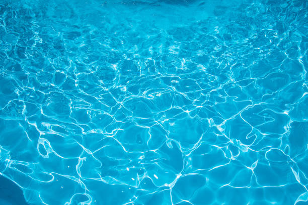 istock Blue and bright ripple water and surface in swimming pool 666866854
