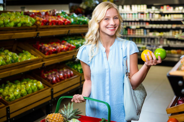 istock Smiling woman holding apples 666878844